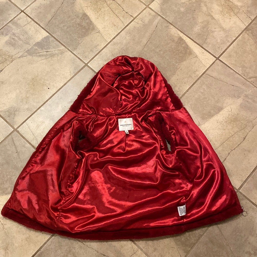 A red vest from the brand urban republic it is a size 14/16